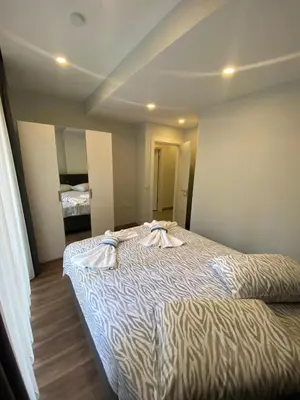 a bedroom with a large bed with towels on it at Şişli Merkezde Konforlu Daire in Istanbul