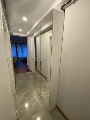 a hallway with a glass door in a room at Şişli Merkezde Konforlu Daire in Istanbul
