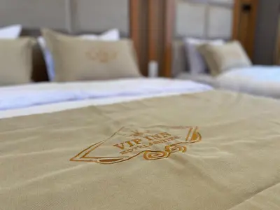 a sign on a bed in a hotel room at Tuyap Vip inn Hotels in Istanbul
