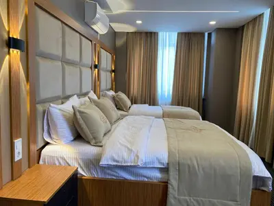 a bedroom with a large bed with white pillows at Tuyap Vip inn Hotels in Istanbul