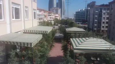 arial view of a city with buildings and umbrellas at Tuyap Vip inn Hotels in Istanbul