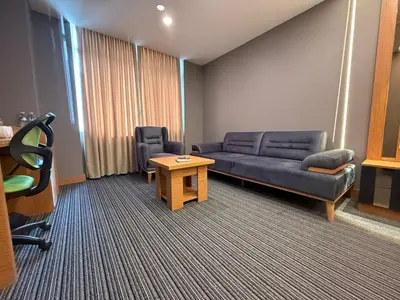 a living room with a couch and a table at Tuyap Vip inn Hotels in Istanbul