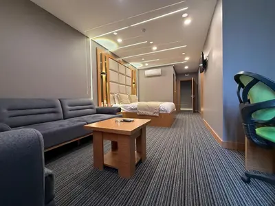 a living room with a couch and a table at Tuyap Vip inn Hotels in Istanbul