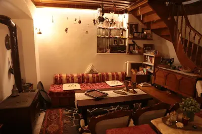 a living room with a couch and a table at Aslibey Konaği - Adults Only in Sapanca
