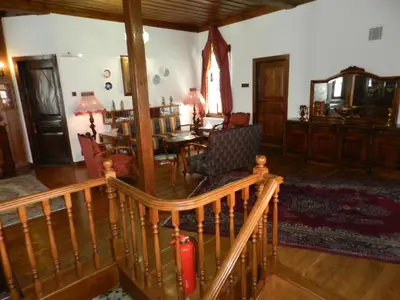 a living room with a table and a dining room at Aslibey Konaği - Adults Only in Sapanca