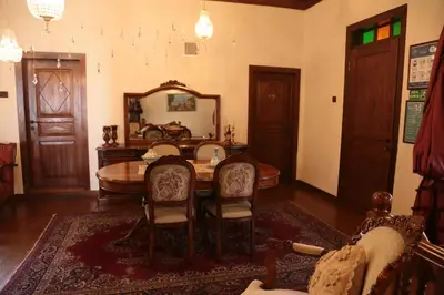 a dining room with a table and chairs and a mirror at Aslibey Konaği - Adults Only in Sapanca