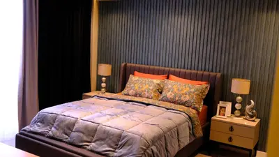 a bedroom with a large bed with orange pillows at Luxury Villa with Private Pool Garden Lake View in Sapanca in Sapanca