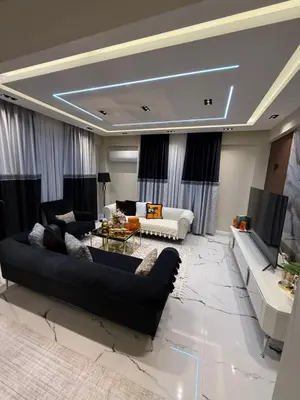 a living room with two couches and a tv at Luxury Villa with Private Pool Garden Lake View in Sapanca in Sapanca