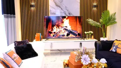 a living room with a fireplace and a tv at Luxury Villa with Private Pool Garden Lake View in Sapanca in Sapanca