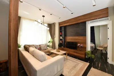 a living room with a couch and a television at Taksim Flat Apartment in Istanbul