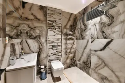 a bathroom with a toilet and a sink at Taksim Flat Apartment in Istanbul