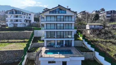 a house with a swimming pool on a hill at 4 Mevsim Konak in Kartepe