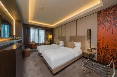 a hotel room with two white beds in a room at Naz City Hotel Taksim - Special Category in Istanbul