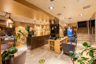 a hair salon with chairs and a staircase in a room at Ayramin Deluxe Hotel Taksim in Istanbul