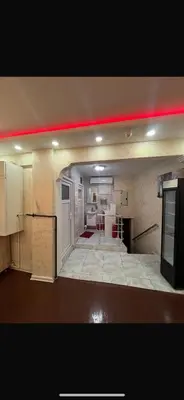 a large room with a kitchen and a red beam at Müstakil kat 2 in Istanbul