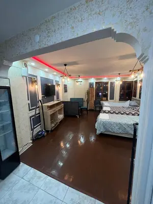 a room with two beds and a living room at Müstakil kat 2 in Istanbul