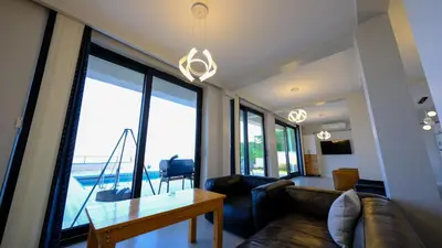 a living room with a couch and a table at 4 Mevsim Konak in Kartepe