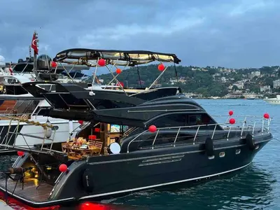 two boats are docked at a dock in the water at Den Den İstanbul in Istanbul