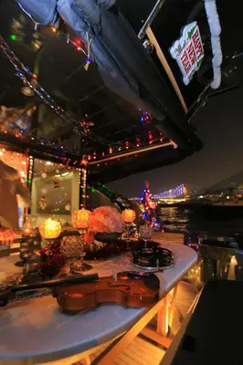 a stage with christmas lights and a guitar on a table at Den Den İstanbul in Istanbul