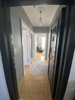 a hallway of a home with a hallway leading to a living room at Sidelya in Ocaklar