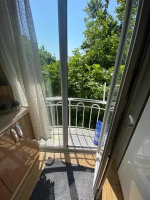 an open door to a balcony with a window at Sidelya in Ocaklar