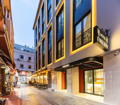 an empty street in a city with a building at Emilion Hotel in Istanbul
