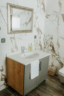 a bathroom with a sink and a mirror at Golyaka Stone Garden Hotel in Orhangazi