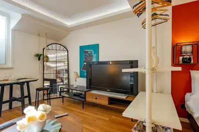 a living room with a large flat screen tv at Studio Apartment in Istanbul
