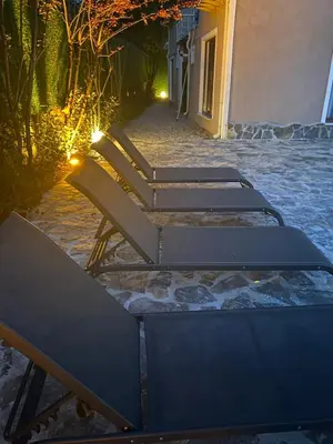 a row of benches sitting on a sidewalk at night at Luxury Big Villa in Sapanca with Pool SKMaxx in Sapanca