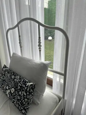 a bed with a pillow in front of a window at Luxury Big Villa in Sapanca with Pool SKMaxx in Sapanca