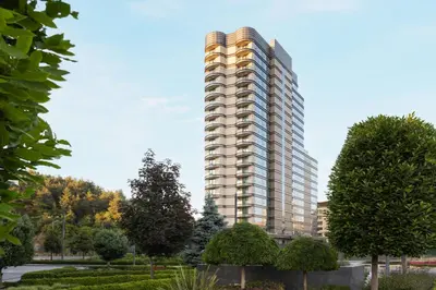a tall apartment building in a park with trees at Marriott Executive Apartments Istanbul Investvadi in Istanbul