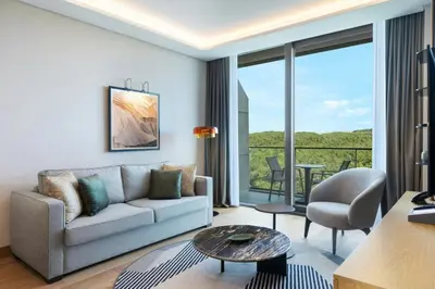 a living room with a couch and a table at Marriott Executive Apartments Istanbul Investvadi in Istanbul