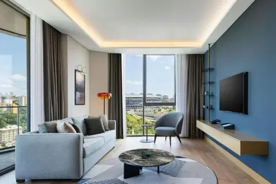 a living room with a couch and a tv at Marriott Executive Apartments Istanbul Investvadi in Istanbul