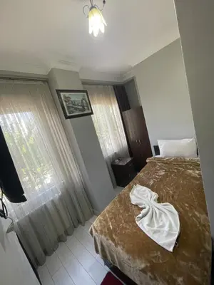 a hotel room with a bed and a window at Hotel Grand Ömer in Istanbul