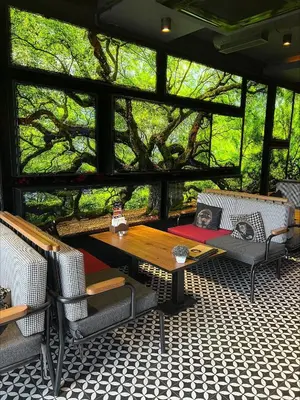 a screened in porch with a table and chairs at Grand Best Nobel Hotel İstanbul in Istanbul