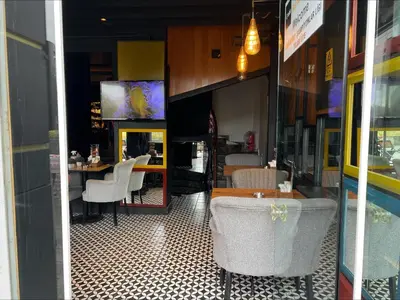 a restaurant with a table and chairs in a room at Grand Best Nobel Hotel İstanbul in Istanbul