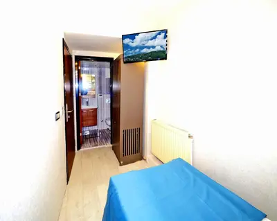 a room with a bed and a flat screen tv at Grand Best Nobel Hotel İstanbul in Istanbul