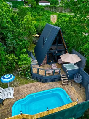 an overhead view of a house with a swimming pool at sapancakelebekvadibungalov in Sapanca