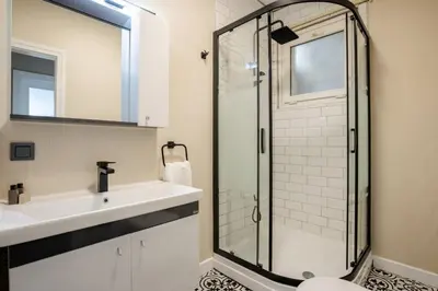 a bathroom with a sink and a shower at Elegant 3BD Bosphorus Views Chic Kadıkoy Home #384 in Istanbul