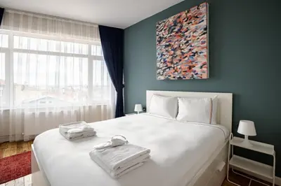 a bedroom with a large white bed with towels on it at Elegant 3BD Bosphorus Views Chic Kadıkoy Home #384 in Istanbul