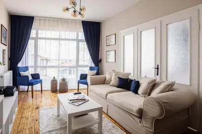 a living room with a couch and a table at Elegant 3BD Bosphorus Views Chic Kadıkoy Home #384 in Istanbul