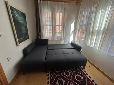 a room with a bed in the corner of a room at Balat Rose - Charming Wooden House with Terrace in Istanbul