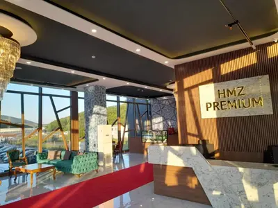 a lobby of a hotel with a sign on the wall at Hmz Premium Konaklama Çekmeköy in Çekmeköy