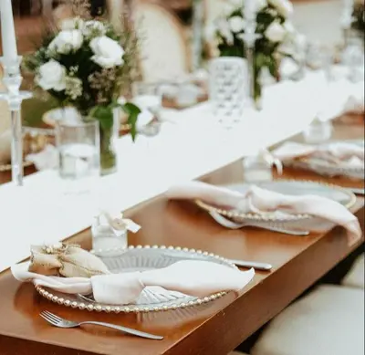 a table with plates and utensils on top of it at Değirmenbaşı Otel & Restoran in Ümmiye