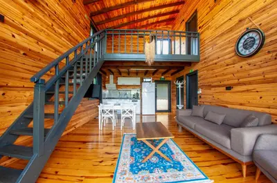 a living room with a couch and a staircase at Rubin Sapanca in Sapanca