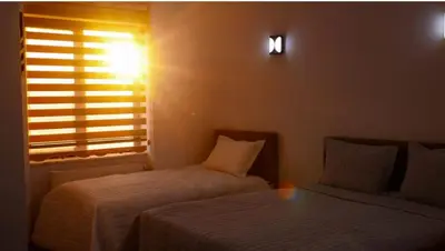 a small room with two beds and a window at Starmax City's Hotel YALOVA in Kâzımiye