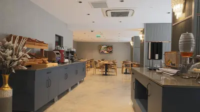 a kitchen and dining room with a table and chairs at The Galata Glory Hotel in Istanbul