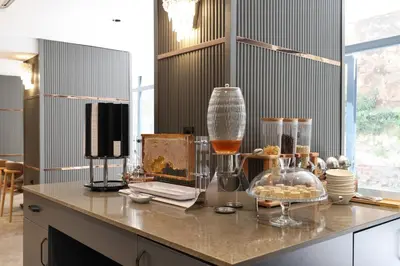 a kitchen with a counter with some food and glasses at The Galata Glory Hotel in Istanbul