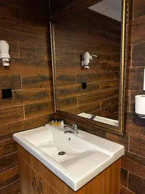 a bathroom with a sink and a mirror at Rüya Otel Şile in Sile