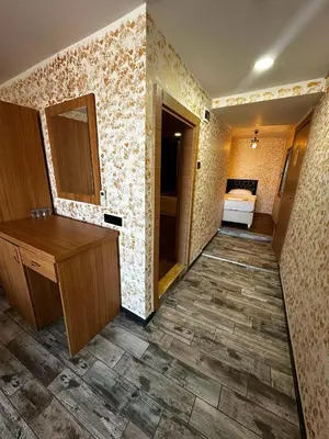 a bathroom with a vanity and a bed in a room at Rüya Otel Şile in Sile